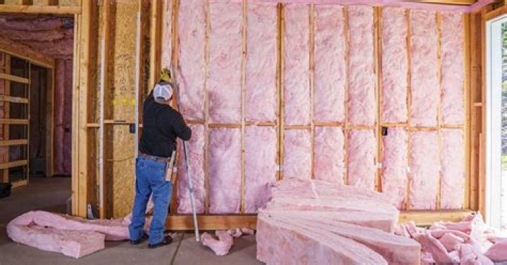 Is this fiberglass insulation safe next to/touching the light bulbs in