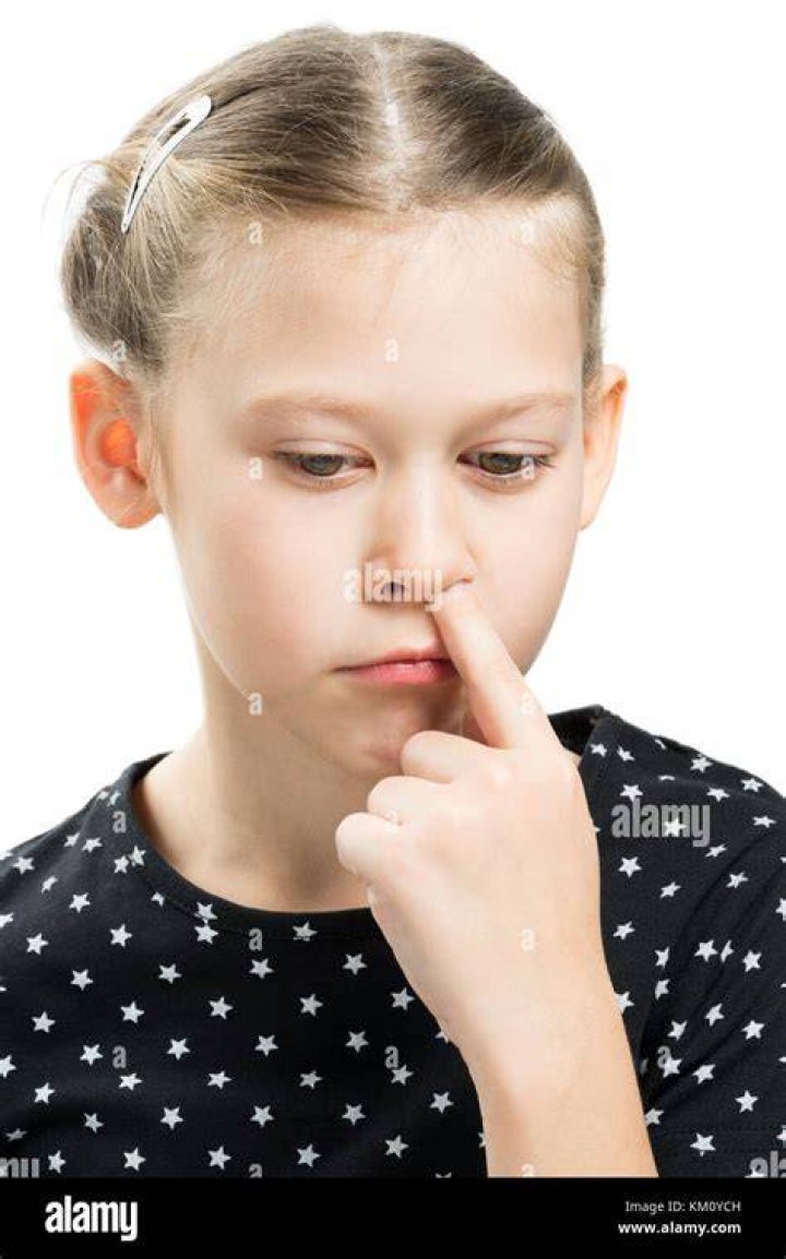 Pressing nose with finger hires stock photography and images Alamy